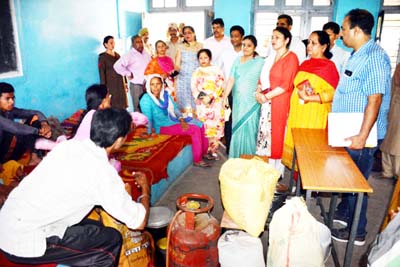 MoS Tourism Priya Sethi during visit to migrant camp in Nowshera.
