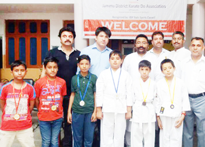 Karatekas posing for a group photograph after winning medals in Jammu District Karate Do Championship. Karatekas posing for a group photograph after winning medals in Jammu District Karate Do Championship.