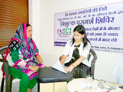 A doctor prescribing medicines to a patient during an infertility camp at Bishnah in Jammu. A doctor prescribing medicines to a patient during an infertility camp at Bishnah in Jammu.