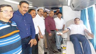 A volunteer donating blood during a camp by Art of Living on Monday. A volunteer donating blood during a camp by Art of Living on Monday.