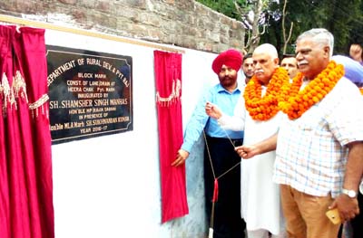 MP Shamsher Singh Manhas and MLA Marh Ch Sukhnandan inaugurating a lane at Hira Chak in Marh constituency on Tuesday.