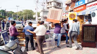 JMC officials during anti-encroachment drive at Jammu on Tuesday. JMC officials during anti-encroachment drive at Jammu on Tuesday.