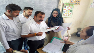 MLC Ch. Vikram Randhawa checking documents during his visit to GMS Kiryani Talab Narwal Bala on Saturday. MLC Ch. Vikram Randhawa checking documents during his visit to GMS Kiryani Talab Narwal Bala on Saturday.