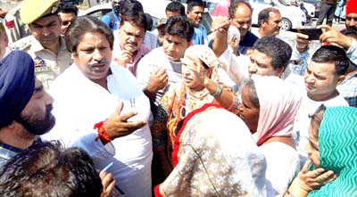Former Minister, Raman Bhalla interacting with protesters at Digiana on Friday.