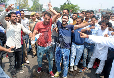 A wireless operator attempting self-immolation during protest at Jammu on Saturday. -Excelsior/Rakesh A wireless operator attempting self-immolation during protest at Jammu on Saturday. -Excelsior/Rakesh