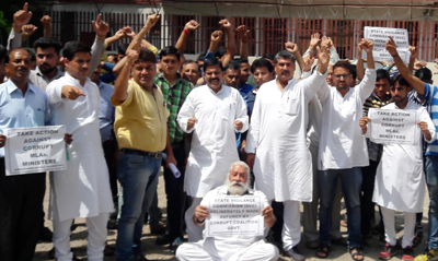 NPP activists staging protest outside SVC in Jammu on Thursday. NPP activists staging protest outside SVC in Jammu on Thursday.
