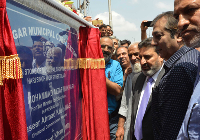 Minister for Education Syed Mohammad Altaf Bukhari laying foundation stone of Municipal Shopping Complex in Srinagar on Thursday. Minister for Education Syed Mohammad Altaf Bukhari laying foundation stone of Municipal Shopping Complex in Srinagar on Thursday.