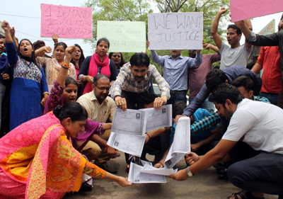 Agitating Polytechnic academic arrangements staff torching their degrees during protest on Friday. Agitating Polytechnic academic arrangements staff torching their degrees during protest on Friday.