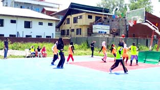 Players in action on the opening day of the Basketball League in Srinagar on Saturday.
