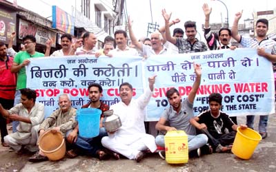 Activists of JWAM protesting against PHE & PDD in Jammu on Monday. Activists of JWAM protesting against PHE & PDD in Jammu on Monday.