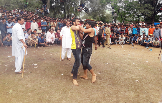 Players in action during Baba Sakisarvar Mela in Mendhar on Monday. Players in action during Baba Sakisarvar Mela in Mendhar on Monday.