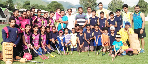 Players posing for a group photograph after the conduct of exhibition hockey matches in Poonch. Players posing for a group photograph after the conduct of exhibition hockey matches in Poonch.