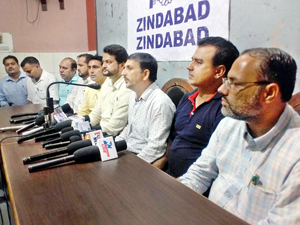 Office bearers of All J&K Patwar Association addressing a press conference at Jammu on Saturday. Office bearers of All J&K Patwar Association addressing a press conference at Jammu on Saturday.