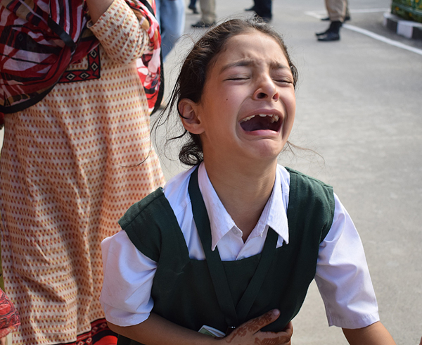 Daughter of policeman Abdul Rashid, cries after hearing news of her father’s killing in Anantnag on Monday. —Excelsior/Shakeel Daughter of policeman Abdul Rashid, cries after hearing news of her father’s killing in Anantnag on Monday. —Excelsior/Shakeel