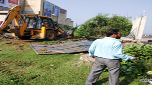 A JCB machine of JDA removing encroachments near Wave Mall. A JCB machine of JDA removing encroachments near Wave Mall.