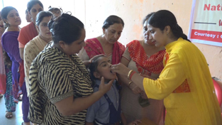 An ASHA worker giving deworming tablet to a child during a camp at Jagti in Jammu. An ASHA worker giving deworming tablet to a child during a camp at Jagti in Jammu.