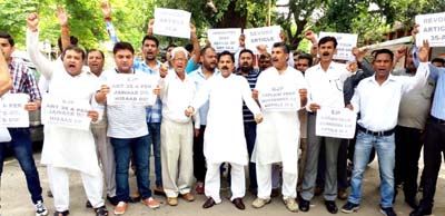 NPP activists staging protest demonstration in Jammu on Saturday. NPP activists staging protest demonstration in Jammu on Saturday.