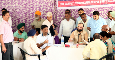 HoD Cardiology GMC Jammu Dr Sushil Sharma examining patients at a free camp in Digiana on Sunday. HoD Cardiology GMC Jammu Dr Sushil Sharma examining patients at a free camp in Digiana on Sunday.