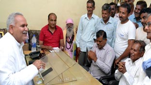 Minister for PHE, Sham Lal Choudhary during a public grievances redressal camp at Suchetgarh on Sunday. Minister for PHE, Sham Lal Choudhary during a public grievances redressal camp at Suchetgarh on Sunday.