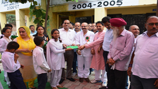 BJP Vice President Yudhvir Sethi distributing uniforms among students of Government High School Pull Tawi on Friday. BJP Vice President Yudhvir Sethi distributing uniforms among students of Government High School Pull Tawi on Friday.