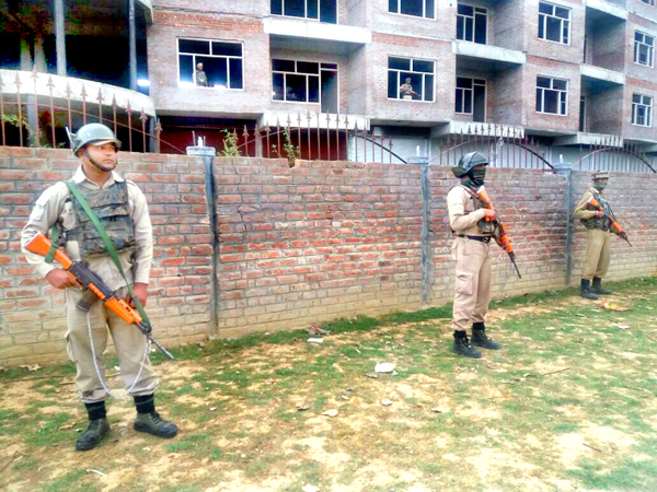 CRPF personnel stand guard at the site of encounter at Nowgam, Srinagar on Thursday. Another pic on page 6. -Excelsior/Shakeel CRPF personnel stand guard at the site of encounter at Nowgam, Srinagar on Thursday. Another pic on page 6. -Excelsior/Shakeel