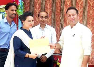 Minister of State for Sports, Sunil Kumar Sharma presenting best teacher award at Adarsh Balniketan School, Kishtwar. Minister of State for Sports, Sunil Kumar Sharma presenting best teacher award at Adarsh Balniketan School, Kishtwar.