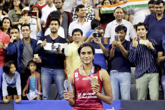 PV Sindhu posing for photograph after clinching Korea Open title. PV Sindhu posing for photograph after clinching Korea Open title.