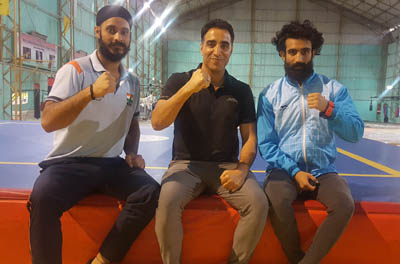 Ace Wushu players Surya Bhanu Partap and Rajinder Singh posing along with Chief Coach of India, Kuldeep Handoo after sealing berth in Indian team. Ace Wushu players Surya Bhanu Partap and Rajinder Singh posing along with Chief Coach of India, Kuldeep Handoo after sealing berth in Indian team.