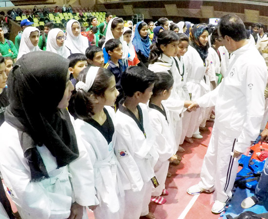 DIG Srinagar, Ghulam Hassan Bhat interacting with players during the inaugural ceremony of sports festival in Srinagar on Sunday. -Excelsior/ Shakeel DIG Srinagar, Ghulam Hassan Bhat interacting with players during the inaugural ceremony of sports festival in Srinagar on Sunday. -Excelsior/ Shakeel