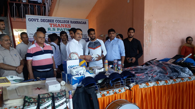 MLA Ramnagar handing over sports material to students on Tuesday. MLA Ramnagar handing over sports material to students on Tuesday.
