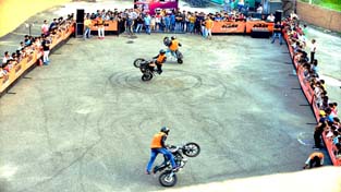 Riders showing different stunts during a show organized by KTM at Bahu Plaza in Jammu. Riders showing different stunts during a show organized by KTM at Bahu Plaza in Jammu.