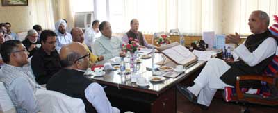 Minister for Revenue, A R Veeri chairing a meeting at Srinagar on Tuesday. Minister for Revenue, A R Veeri chairing a meeting at Srinagar on Tuesday.