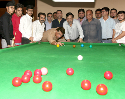 Chairman JKBSA, Sidharth Sharma aiming at target while declaring State Snooker and Billiards Championship open. —Excelsior/Rakesh Chairman JKBSA, Sidharth Sharma aiming at target while declaring State Snooker and Billiards Championship open. —Excelsior/Rakesh
