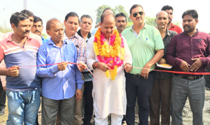 MLA Samba, D K Manyal inaugurating a transformer at Lower Jallochak on Tuesday. —Excelsior/Gautam MLA Samba, D K Manyal inaugurating a transformer at Lower Jallochak on Tuesday. —Excelsior/Gautam
