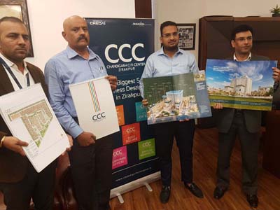 Officials of Chandigarh Citi Center releasing brochure of commercial real estate project at Jammu on Saturday. Officials of Chandigarh Citi Center releasing brochure of commercial real estate project at Jammu on Saturday.