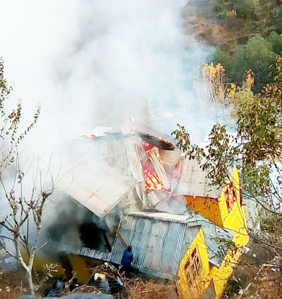 A residential house in flames in Kahara area of district Doda. -Excelsior/ Tilak Raj A residential house in flames in Kahara area of district Doda. -Excelsior/ Tilak Raj