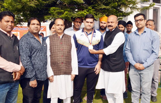 BJP leader Yudhvir Sethi honouring meritorious Taekwondo players in Jammu on Wednesday. BJP leader Yudhvir Sethi honouring meritorious Taekwondo players in Jammu on Wednesday.