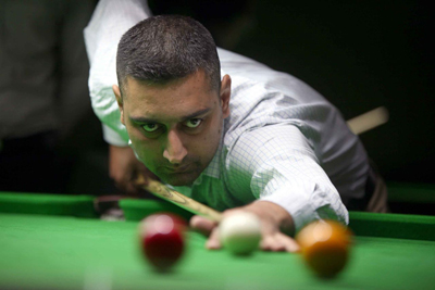 Cueist Suhail Khalid aiming at target during a final match of State Senior Billiards Championship in Jammu. Cueist Suhail Khalid aiming at target during a final match of State Senior Billiards Championship in Jammu.