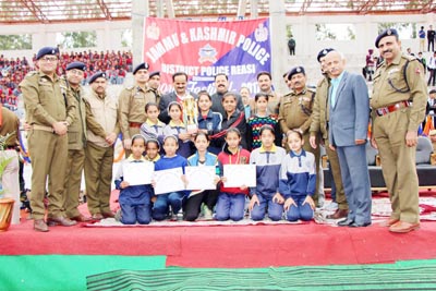 Winners posing along with Police Officers during closing ceremony of Sports Festival at Reasi on Friday. Winners posing along with Police Officers during closing ceremony of Sports Festival at Reasi on Friday.