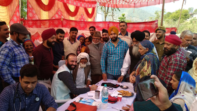 HoD Cardiology GMC Jammu examining a patient at Gurudwara Dheri Sahab in Poonch on Sunday. HoD Cardiology GMC Jammu examining a patient at Gurudwara Dheri Sahab in Poonch on Sunday.