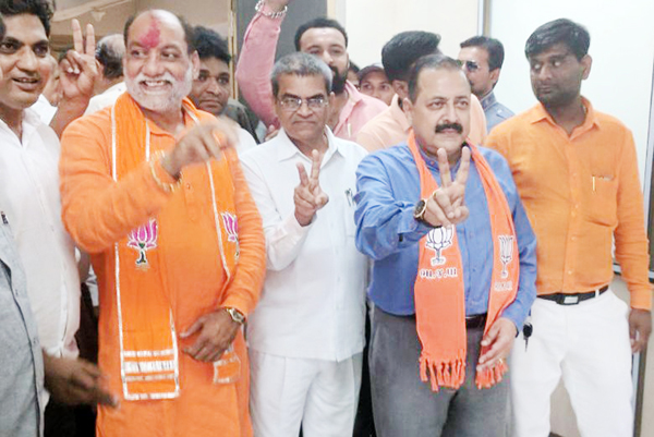 Union Minister and BJP Gujarat Election Co-Incharge Dr Jitendra Singh along with party candidate Kumarbhai Shivabhai Kanani coming out from the office of the Returning Officer after filing nomination papers from the crucial Varachha Assembly Constituency dominated by Pattidar community, at Surat on Monday. Union Minister and BJP Gujarat Election Co-Incharge Dr Jitendra Singh along with party candidate Kumarbhai Shivabhai Kanani coming out from the office of the Returning Officer after filing nomination papers from the crucial Varachha Assembly Constituency dominated by Pattidar community, at Surat on Monday.