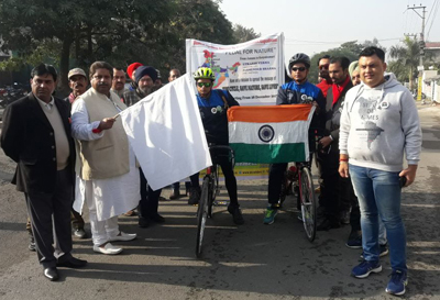 Former Minister Raman Bhalla flagging off cyclists at Jammu. Former Minister Raman Bhalla flagging off cyclists at Jammu.