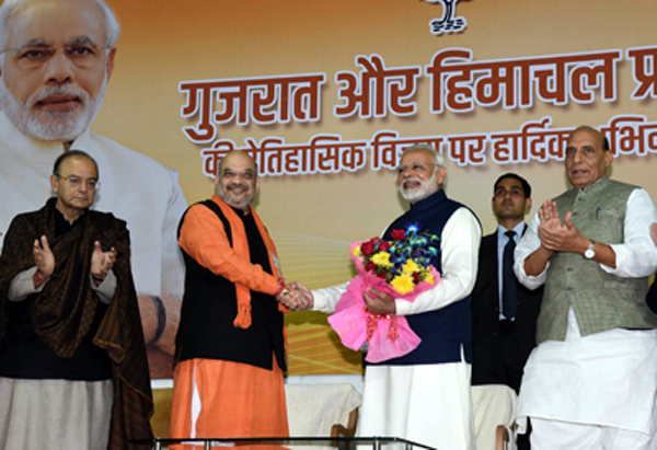 Prime Minister Narendra Modi being received by BJP president Amit Shah at BJP headquarters after the party's landslide victory in Gujarat and Himachal Pradesh Assembly elections in New Delhi on Monday. (UNI) Prime Minister Narendra Modi being received by BJP president Amit Shah at BJP headquarters after the party's landslide victory in Gujarat and Himachal Pradesh Assembly elections in New Delhi on Monday. (UNI)