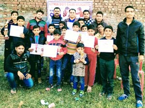 Winners of Kathua District Chess Championship posing for group photograph with dignitaries. Winners of Kathua District Chess Championship posing for group photograph with dignitaries.