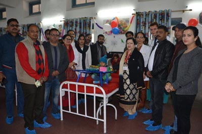 Dr Sunanda Raina, Principal, GMC Jammu, presenting gift to a child in pediatric oncology ward in SMGS Hospital, Jammu. Dr Sunanda Raina, Principal, GMC Jammu, presenting gift to a child in pediatric oncology ward in SMGS Hospital, Jammu.