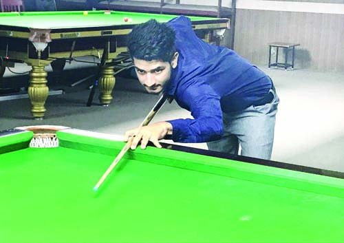 Cueist aiming at target during Billiards National Championship in Bangalore. Cueist aiming at target during Billiards National Championship in Bangalore.