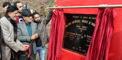 Minister for R&B, Naeem Akhtar and Minister for Animal & Sheep Husbandry, AG Kohli inaugurating bridge in Rajouri on Thursday. Minister for R&B, Naeem Akhtar and Minister for Animal & Sheep Husbandry, AG Kohli inaugurating bridge in Rajouri on Thursday.