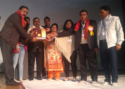 Surinder Sharma, son of ex-MLA late Risikesh Sharma receiving award on behalf of his father from VBKP national president S. Kaushik at Katra on Sunday. Surinder Sharma, son of ex-MLA late Risikesh Sharma receiving award on behalf of his father from VBKP national president S. Kaushik at Katra on Sunday.