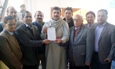 MP Jugal Kishore handing over authority letter for release of Rs 10 lakh to Red Cross members. MP Jugal Kishore handing over authority letter for release of Rs 10 lakh to Red Cross members.