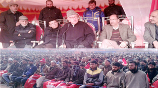 NC president, Dr Farooq Abdullah addressing large public meeting in Khan Sahib area of Budgam on Saturday. NC president, Dr Farooq Abdullah addressing large public meeting in Khan Sahib area of Budgam on Saturday.